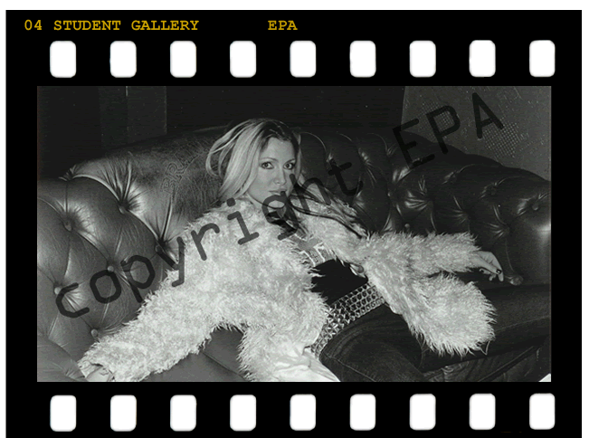 Photo of Model Caprice lounging on a sofa