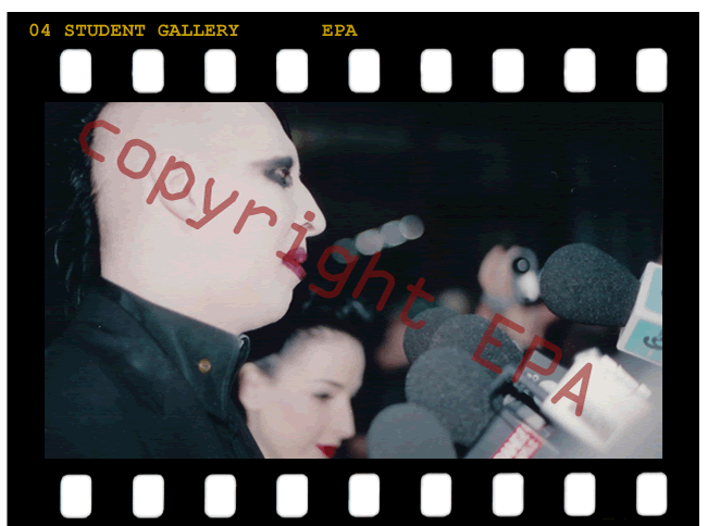 Photo of Rock star Marilyn Manson answering questions at microphone